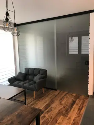 a living room with a couch and a table at Pszczelna Loft in Kraków
