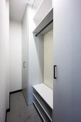 a room with white walls and a walk in closet at Native Apartments Barska 69 in Kraków