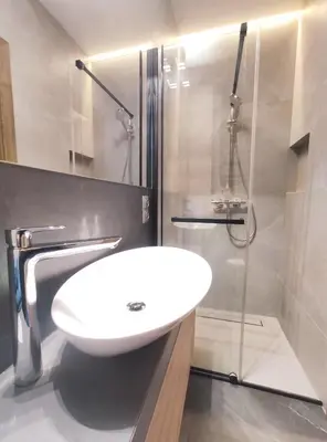 a bathroom with a white sink and a shower at Celna 7 by Homeprime in Kraków
