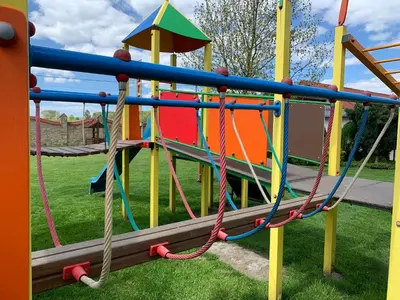 a colorful playground with a slide at Hotel August in Brzesko