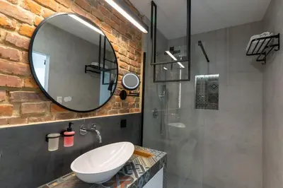 a bathroom with a sink and a mirror at mN apartments home - Wieliczka Town in Wieliczka