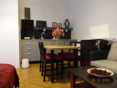 two beds sitting next to each other in a room at Nowy Kleparz 1 in Kraków