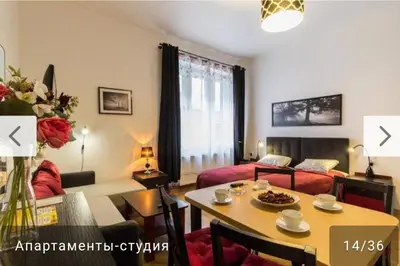 a living room with a couch and a table at Nowy Kleparz 1 in Kraków