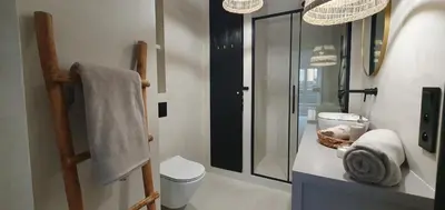 a bathroom with a toilet and a glass shower at Fly_to_Cracow_12 in Kraków