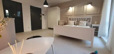 a living room with a couch and a table at Fly_to_Cracow_12 in Kraków