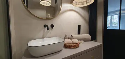 a bathroom with a white sink and a mirror at Fly_to_Cracow_12 in Kraków