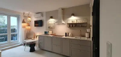 a large kitchen with a sink and a window at Fly_to_Cracow_12 in Kraków