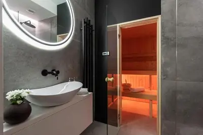 a bathroom with a white sink and a shower at Ucieknij do luksusu: Villa Wola in Kraków