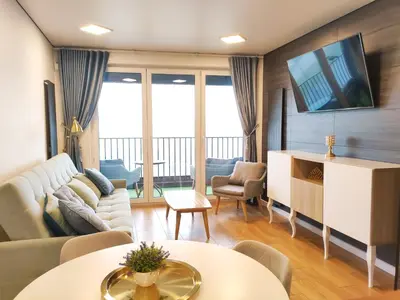 a living room with a couch and a tv at Zabłocie 35 by Homeprime in Kraków
