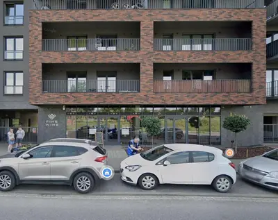 a group of cars parked in front of a building at Zabłocie 35 by Homeprime in Kraków