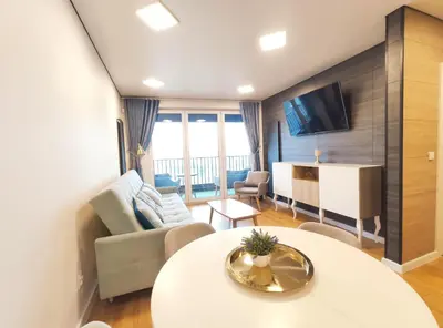 a living room with a couch and a table at Zabłocie 35 by Homeprime in Kraków