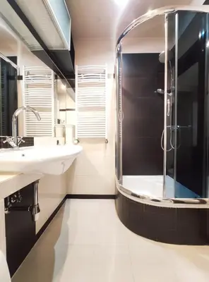a bathroom with a shower and two sinks at Józefa 2 by Homeprime in Kraków
