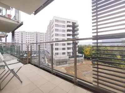 an apartment balcony with a view of a building at Śliczna 34A by Homeprime in Kraków
