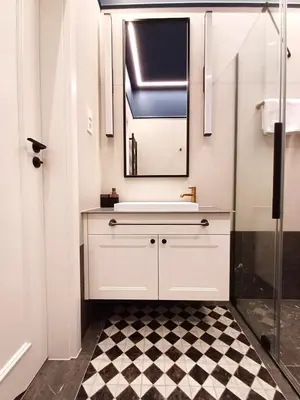 a white bathroom with a sink and a mirror at TRUE COLORS Old Town Apartments - Wawel & Vistula River - Homelike Kraków in Kraków