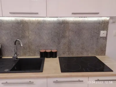 a kitchen with a sink and a counter top at Mała Góra Apartment in Kraków