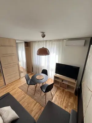 a bedroom with a large bed with two towels on it at Apartament Sołtysowska- garaż bezpłatny, NEAR Tauron Arena, EXPO in Kraków