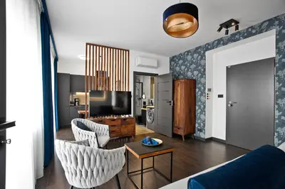 a living room with a couch and a tv at Near Sanktuarium Beautiful View and Free Parking in Kraków