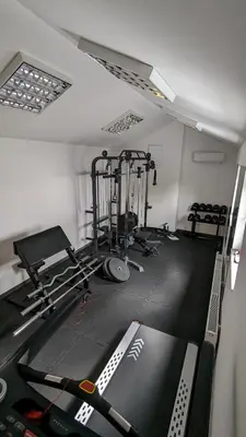 a room with a gym with some equipment in it at Near Sanktuarium Beautiful View and Free Parking in Kraków
