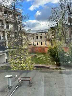 an empty parking lot with a skateboard in the street at Hostel Demi in Kraków