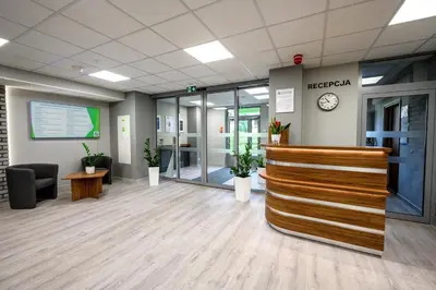 a lobby of an office with a reception desk at Pokoje Gościnne MODR in Karniowice