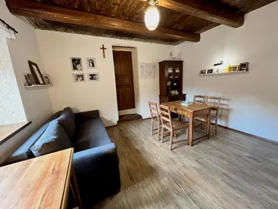 a living room with a couch and a table at MATOGÓWKA in Krzeszowice