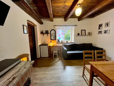 a living room with a couch and a table at MATOGÓWKA in Krzeszowice