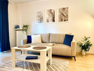 a living room with a couch and a table at Angel MINT Apartment - FREE PARKING - Balcony in Kraków