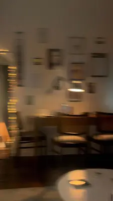 a blurry picture of a restaurant with chairs and tables at D7 Apartment in Kraków