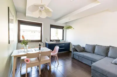 a living room with a couch and a table at Modern House in Old Town Numero 5 in Kraków