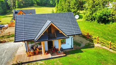an overhead view of a small house on a hill at Gliniana Chata in Zawoja