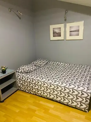 a bedroom with a bed in a room at Centrum Apart in Kraków
