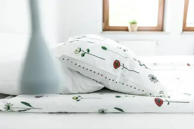 two pillows on a bed in a room at Modern House in Old Town Numero 8 in Kraków
