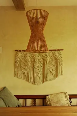 a chandelier hanging over a bed in a room at BlissHouse Luxurious Guesthouse calm and energetic spot near by city surrounded by the forest where you will find your peace and your people in Kraków