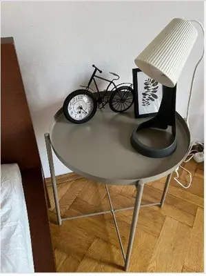 a bedroom with a bed with two towels on it at Cheerful 3 bedroom city house in Kraków