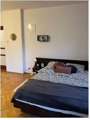 a bathroom with a tub and a toilet and a sink at Cheerful 3 bedroom city house in Kraków