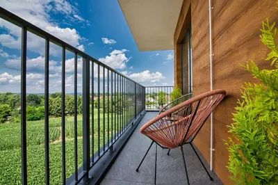a balcony with a bench and a view at Apartament Nairobi by Housine in Zator