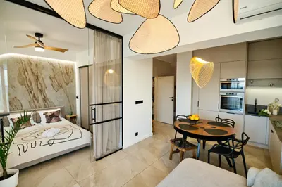 a bedroom with a bed and a table in a room at Apartament Nairobi by Housine in Zator