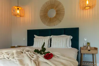 a bedroom with a bed with a red rose on it at Lamelove Apartments - Energylandia, Zator in Chocznia