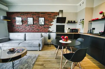 a living room with a couch and a table at Blues Room by Housine in Zator