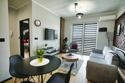 a living room with a couch and a table at Blues Room by Housine in Zator