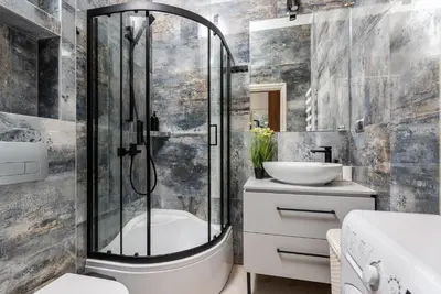 a bathroom with a shower and a sink at Premium Splendid Old Town Suites - by Upstairs in Kraków