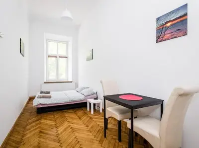 a living room with a table and a couch at CASIO in Kraków