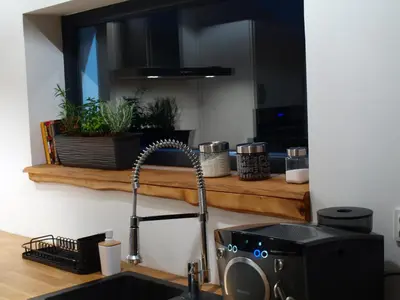 a kitchen counter with a sink and a sink at Panorama Racławicka Domek Willa Basen Agroturystyka in Janowiczki