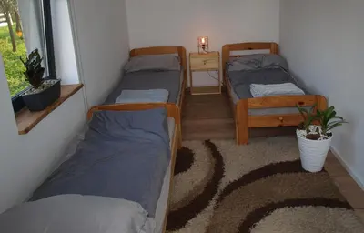 a room with three bunk beds and a window at Panorama Racławicka Domek Willa Basen Agroturystyka in Janowiczki