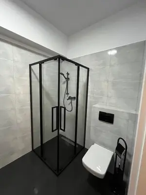 a bathroom with a shower and a toilet at Apartament Marko Due in Zator