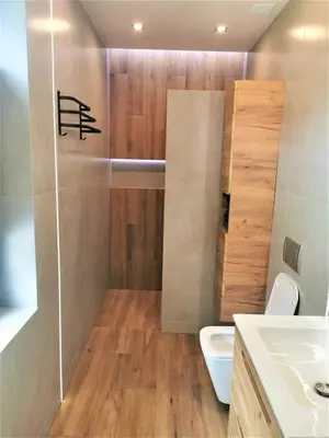 a bathroom with a shower and a toilet and a sink at Secret House Zator in Zator