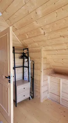a wooden room with a bunk bed in a cabin at Domek na Kleninie z gorącą balią in Kamienica