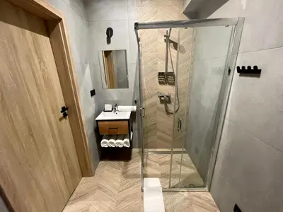 a bathroom with a shower and a sink at Apartament Róża 1 Zator - 2 km od Energylandii in Zator