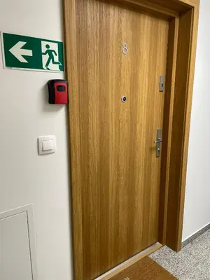 a wooden door with a sign on a wall at Apartament Róża 1 Zator - 2 km od Energylandii in Zator
