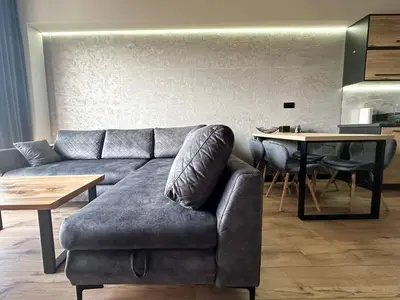 a living room with a couch and a table at ApartLoft 64 Apartament Zator in Zator